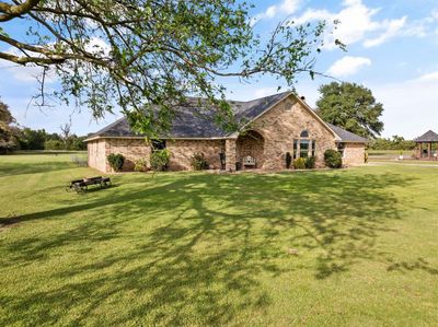 View of front of home featuring a front yard | Image 1