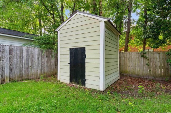 View of shed with a fenced backyard | Image 33