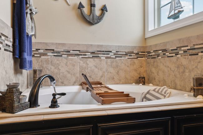 A beautiful soaking bathtub provides the perfect place to unwind. 1107 Sycamore Leaf Way Murfreesboro, TN 37129 | Image 20