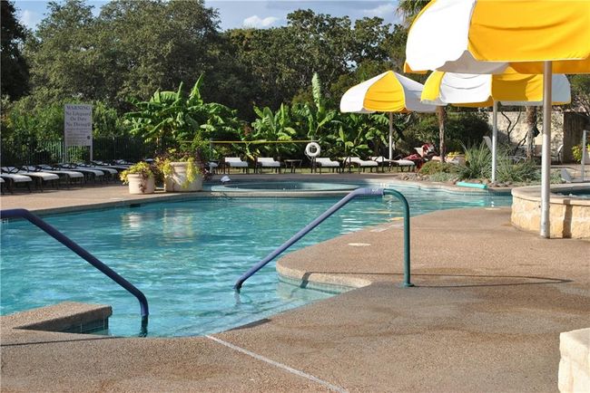 Outdoor pool and hot tub at one of four activity centers. | Image 37
