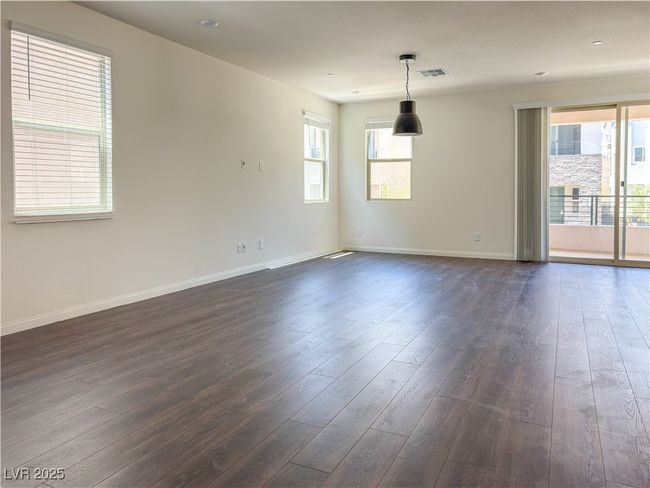 Empty room featuring dark wood-style floors and baseboards | Image 8