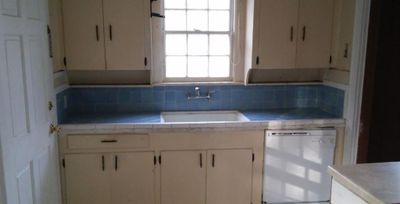 Kitchen with white cabinetry, sink, tasteful backsplash, and dishwasher | Image 3