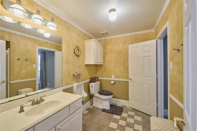 Full bath on the 1st level, shower behind the door | Image 12