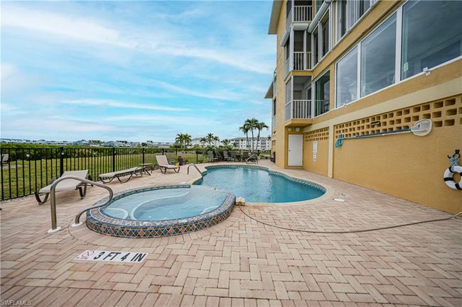 View of swimming pool with a patio and a hot tub | Image 40
