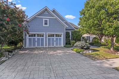 Welcome to Jockey Club. 3 Bedroom 2 full bath home with 2 car garage with loft storage. This custom home has 10ft Ceilings throughout with build in sound system in every room | Image 1