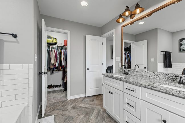 Bathroom featuring double vanity, recessed lighting, baseboards, and a spacious closet | Image 21