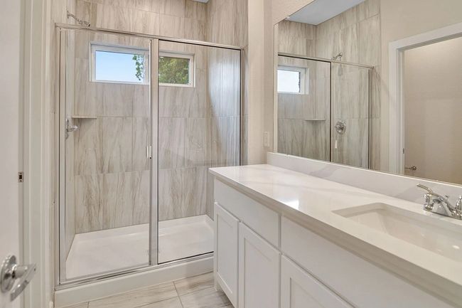 Full bathroom featuring a shower stall and vanity | Image 12