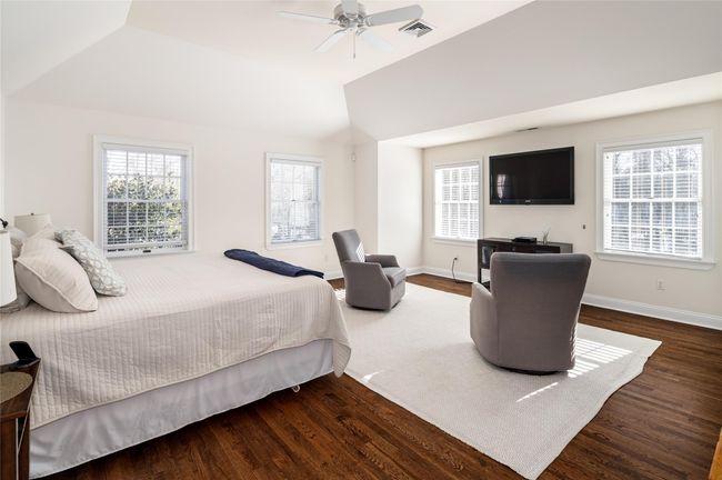 Primary Bedroom featuring ceiling fan, lofted ceiling, and dark hardwood flooring | Image 18