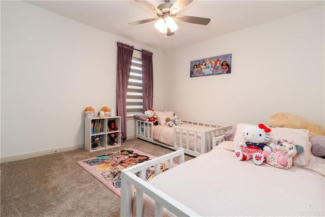 Carpeted bedroom featuring baseboards and a ceiling fan | Image 12