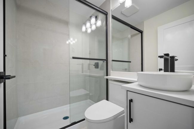 Full bathroom featuring a stall shower and vanity | Image 19