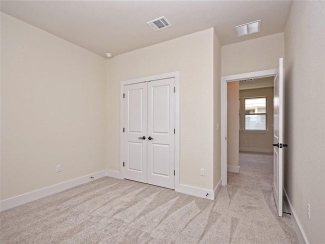 Unfurnished bedroom featuring light carpet and a closet | Image 13