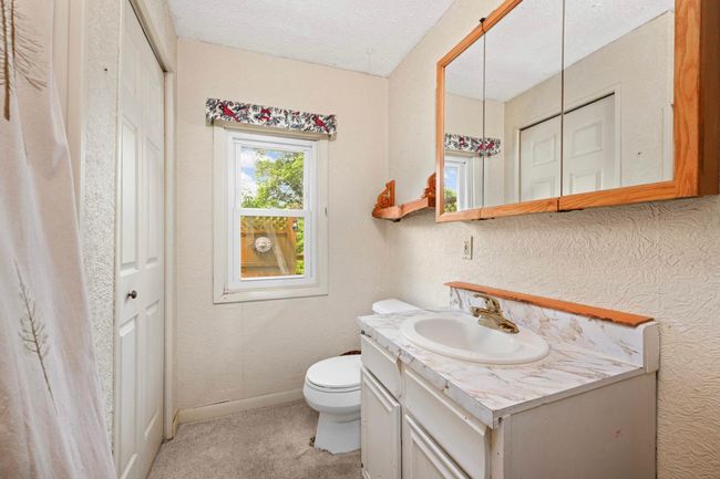 Full bath with linen closet. | Image 11
