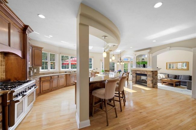 Enjoy meal preparation utilizing the six-burner Thermador gas range, Samsung refrigerator and Bosch dishwasher. | Image 18