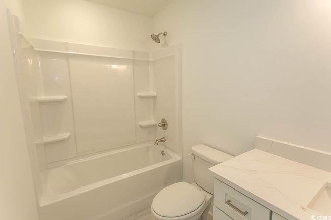 Full bath featuring shower / tub combination, toilet, and vanity | Image 20