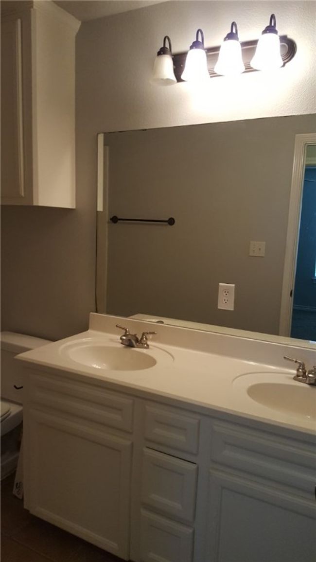 Full bathroom featuring double vanity and tile patterned flooring | Image 14