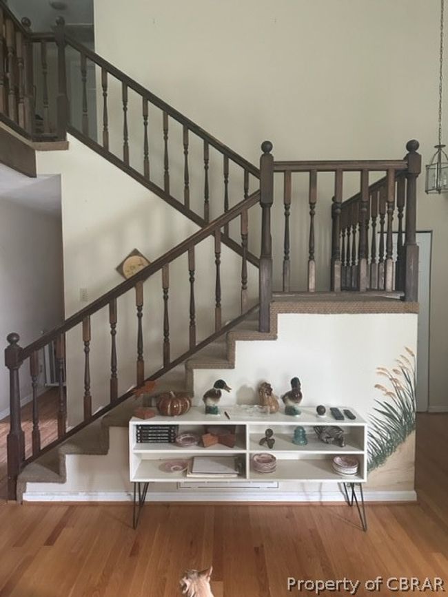 Stairs featuring hardwood / wood-style flooring | Image 6