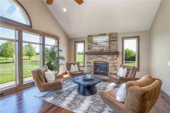 Hearth room gas fireplace flooded with natural light. | Image 17