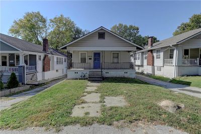 Bungalow-style home with a front lawn and a porch | Image 2