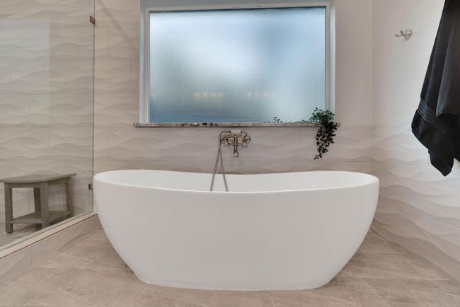 Designed for indulgence, this soaking tub offers a tranquil escape within the beautifully appointed primary suite. | Image 28