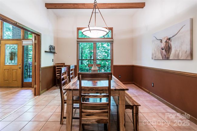 Gatherings are made easy in this spacious dining room. | Image 11