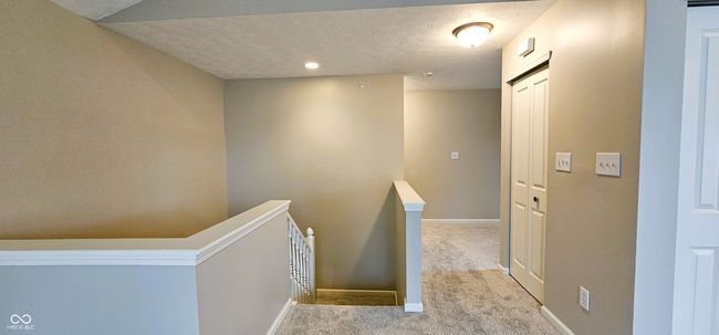Top of stairs leading to bedroom and office/flex room | Image 6