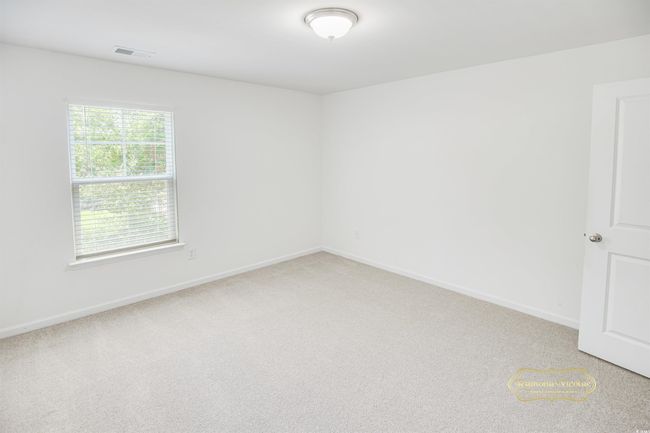 Unfurnished room with light colored carpet and baseboards | Image 27