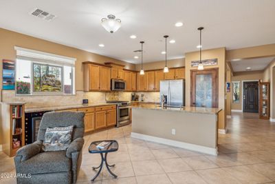 Kitchen with granite counters and lots of cabinets | Image 2