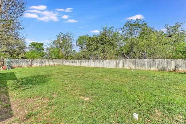 View of large yard featuring a fenced backyard | Image 25