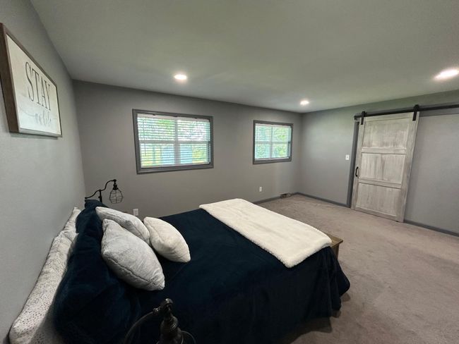 Walk in closet with bar door | Image 26
