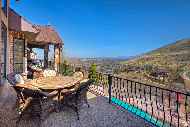 Balcony with a mountain view and outdoor dining area | Image 31