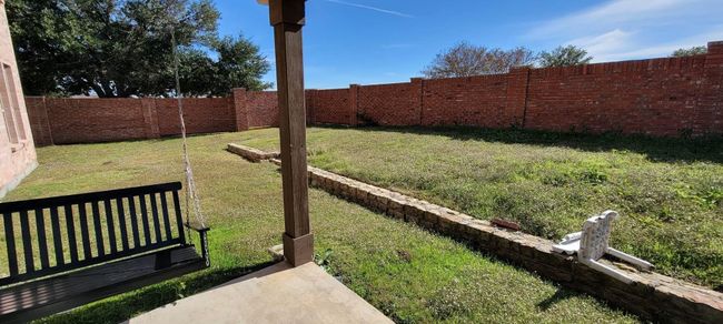 View of fenced backyard | Image 20