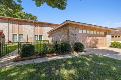 View of front of house with a garage and a front lawn | Image 2