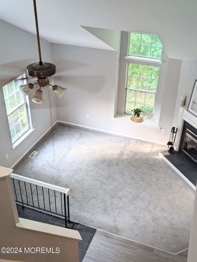 Beautiful living room w/ brand new carpet, freshly painted, wood burning FP, beautiful windows! | Image 2