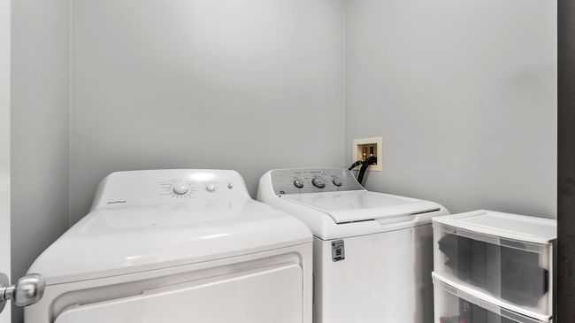 Clothes washing area with washer and clothes dryer and laundry area | Image 24
