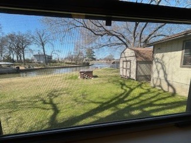 View of grassy yard with a water view | Image 5