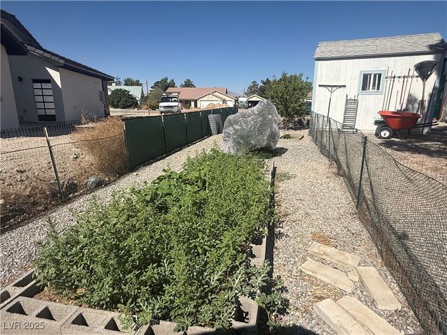 View of fenced backyard | Image 59