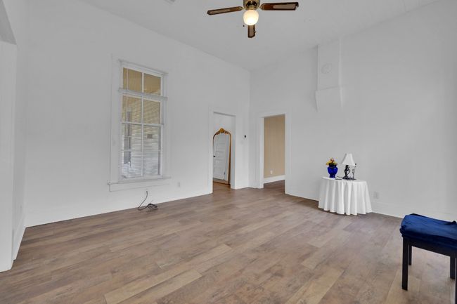 Unfurnished room featuring baseboards, wood finished floors, and ceiling fan | Image 19