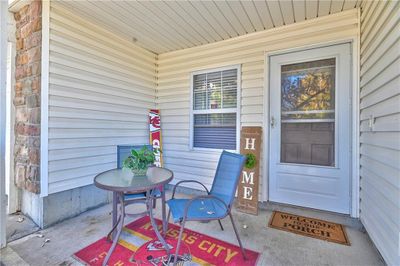 Doorway to property featuring a porch | Image 3