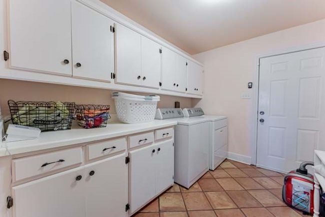 Separate laundry and storage room. | Image 17