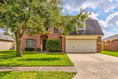 Welcome to 5327 Morgans Landing Lane! You will be met with beautiful curb appeal and fresh landscaping. | Image 1