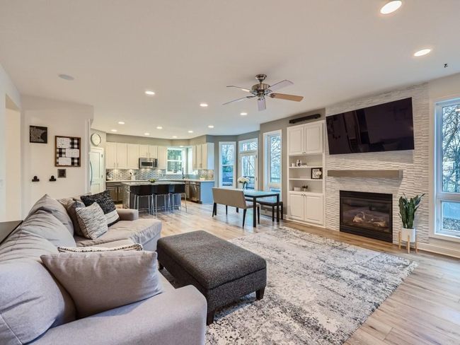 Family Room features Gorgeous Stone Fireplace | Image 5