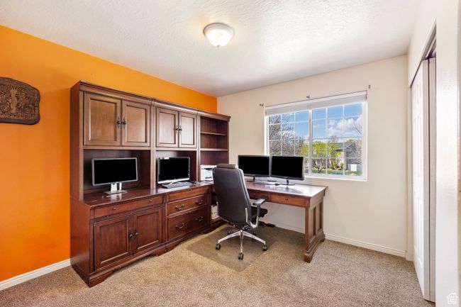 Office space featuring light carpet, a textured ceiling, and baseboards | Image 25