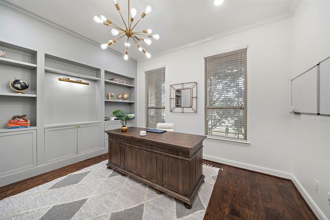 A dedicated study complete with built in book shelving, lighting and french doors. | Image 9
