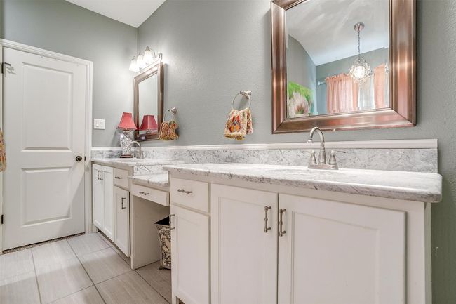 Bathroom with a sink and double vanity | Image 12