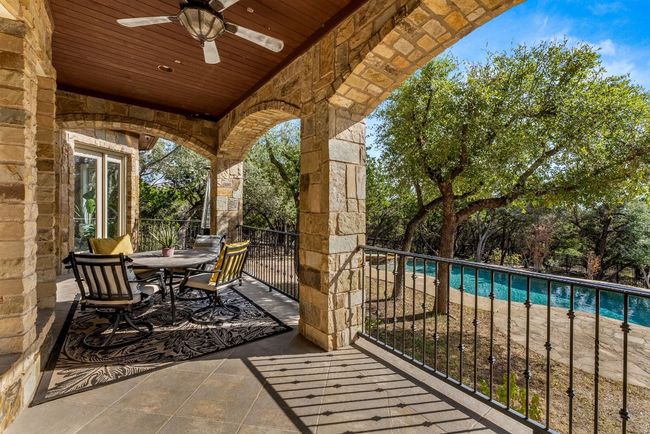 Main level back patio overlooking the pool. | Image 30