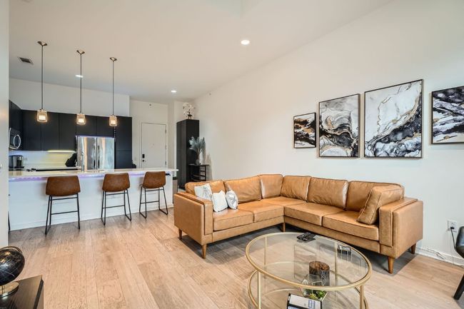 Living room with visible vents, light wood-style flooring, and recessed lighting | Image 6
