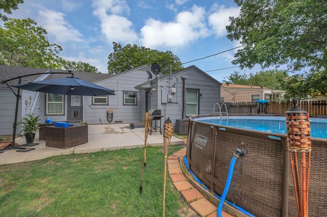 Back of property with a patio and a shingled roof | Image 19