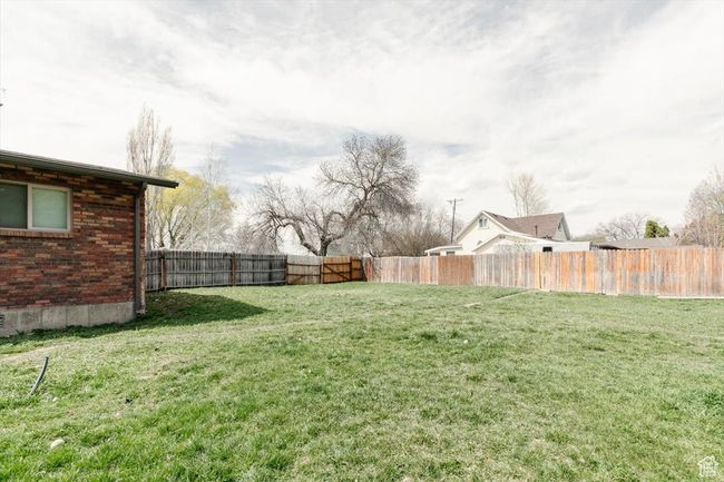 View of yard featuring a fenced backyard | Image 36