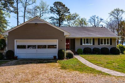 Single story home featuring a garage and a front lawn | Image 2