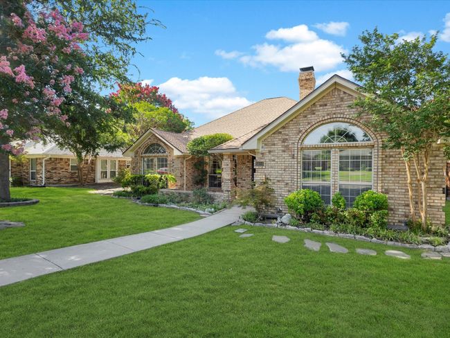 Large covered front porch is perfect for early morning coffee. | Image 5